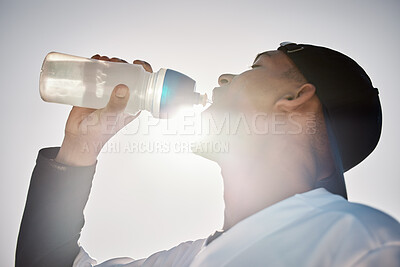 Buy stock photo Baseball player, drinking water or thirsty sports man on field in training match or game in a stadium. Sunshine, cardio fitness workout or healthy softball athlete drinks liquid for energy in summer 