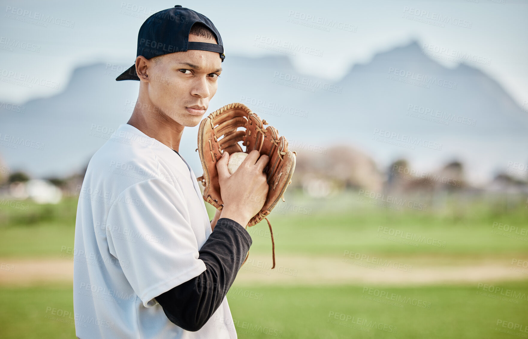 Buy stock photo Portrait pitcher, ready or baseball player training for a sports game on outdoor field stadium. Fitness, softball athlete or focused man pitching or throwing a ball with glove in workout or exercise