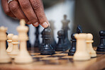 Man, chess and hands with bishop on board, strategy challenge and tournament games. Checkmate, chessboard and smart player playing in contest, problem solving and moving pieces to win competition