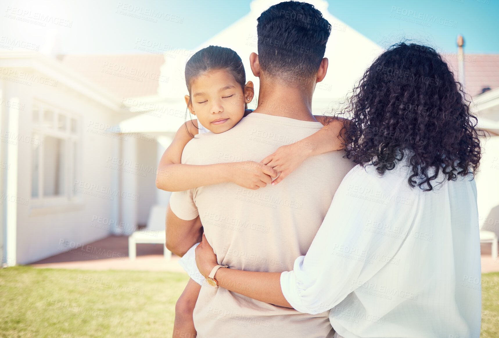 Buy stock photo Young family, back and outdoor at new home with girl child, hug or together for love, beginning and start to life. Couple, mother and daughter with man holding kid for real estate, house and backyard