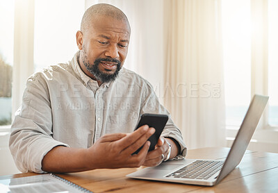 Buy stock photo Phone, laptop and remote work with a black man checking his debt or banking from the home office. Pension, contact and communication with senior male working on finance in a living room of his house