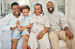 Happy, smile and portrait of a black family on a sofa relaxing, resting or bonding together. Happiness, love and African boy child sitting with his mother and grandparents on a couch in living room.