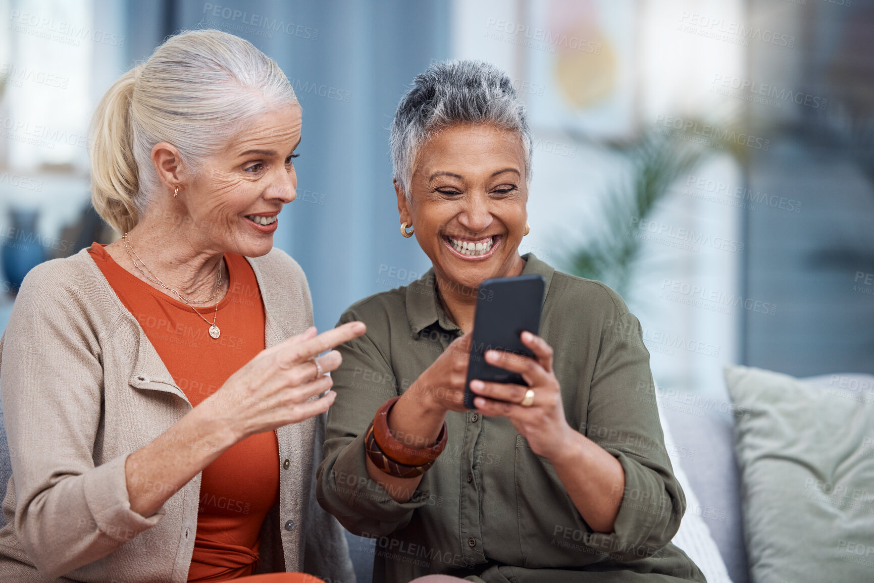 Buy stock photo Elderly women, phone social media and living room with senior females with mobile connectivity. Video streaming, happiness and conversation at a house with old people together on technology at home