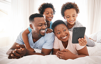 Buy stock photo Happy, selfie and relax with black family in bedroom for bonding, social media and connection. Wake up, morning and affectionate with parents and children at home for weekend, picture and happiness