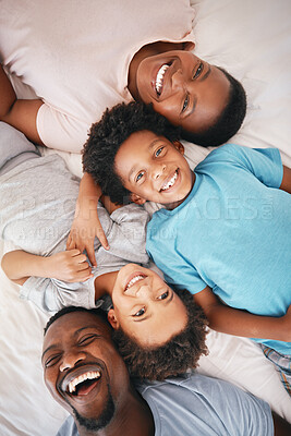 Buy stock photo Black family, bedroom portrait and top view with smile, happiness and kids with funny time with dad, mom and love. Happy children, parents and bed for bonding, care and support in morning for holiday