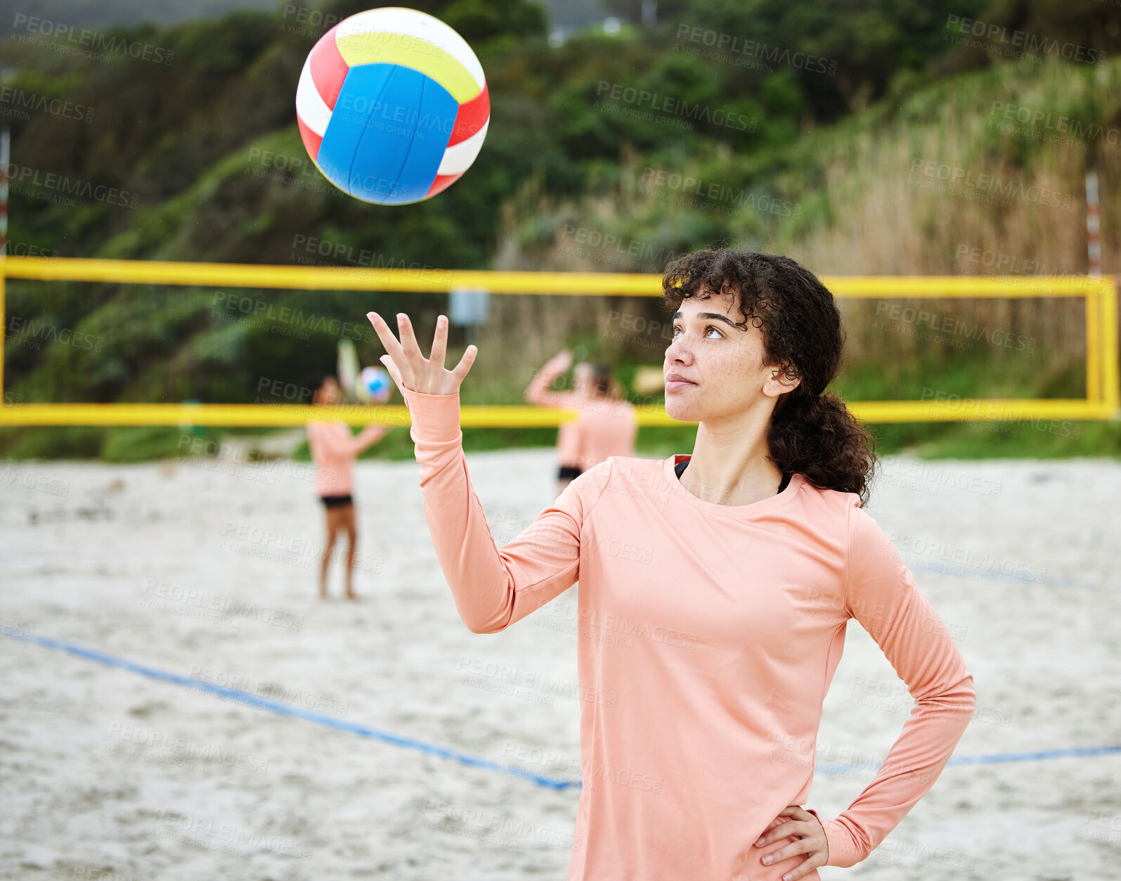 Buy stock photo Ready, playing and girl with a volleyball at the beach for sports, hobby and game in California. Start, professional and woman throwing a ball in the air for a competition, vacation fun or match