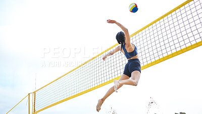 Buy stock photo Sports, volleyball and woman jump at beach to hit ball in competition, game or match. Training, exercise and female athlete jumping for spike in tournament for workout, fitness and health at seashore