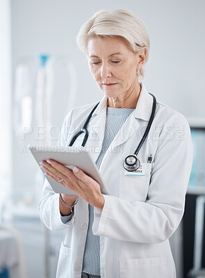 Buy stock photo Healthcare, research and senior doctor with tablet for online consulting, telehealth and wellness app. Cardiology, hospital and woman on digital tech for internet, medical results and patient data