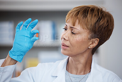 Buy stock photo Pharmacy, pharmacist and senior woman with pills, medication or antibiotics in drugstore. Healthcare, wellness and medical doctor looking and inspecting medicine or drugs, vitamins or supplements.