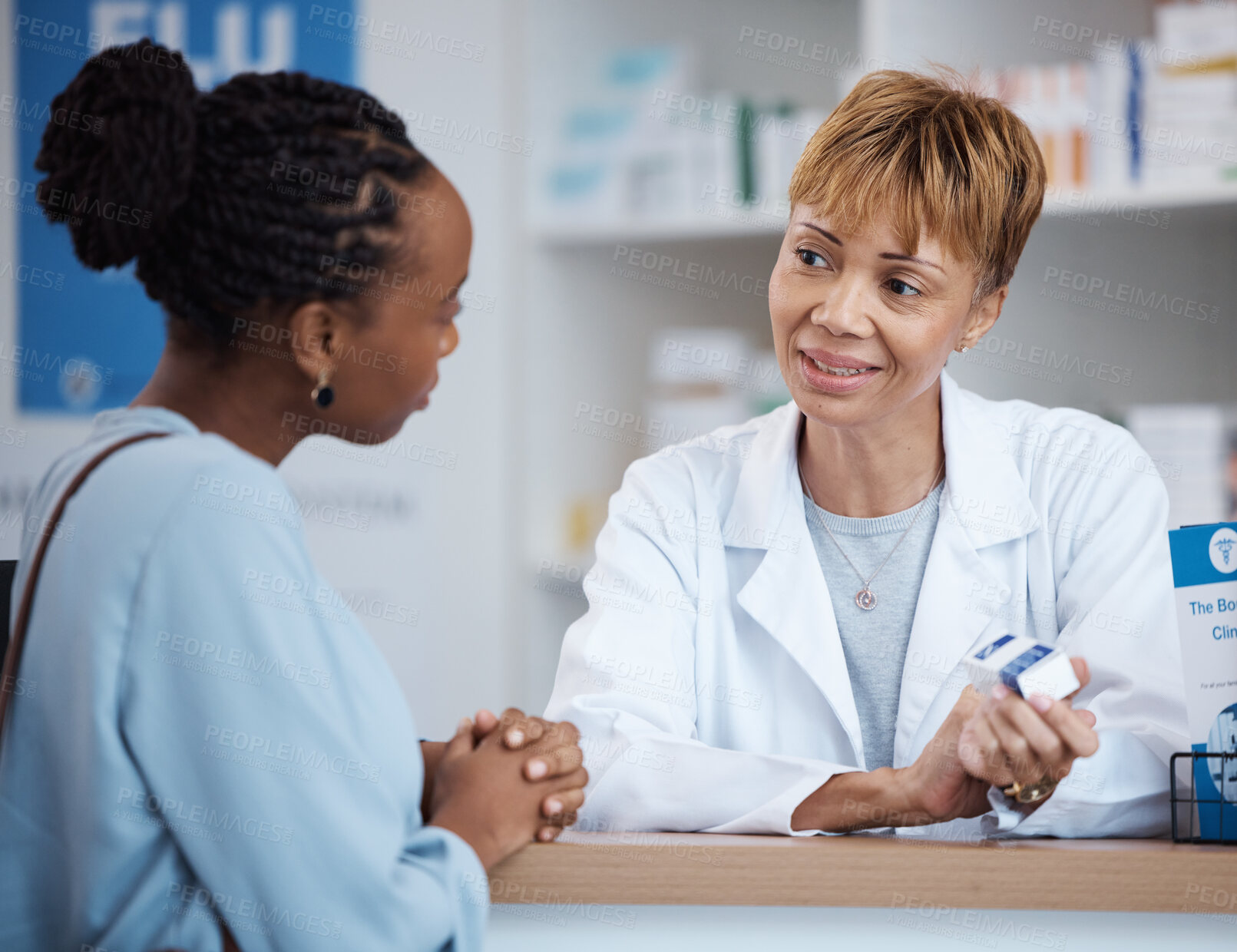 Buy stock photo Healthcare, help and black woman with pharmacist at counter for advice on safe medicine and prescription drugs. Health, pharmaceutical info and patient consulting medical professional at pharmacy.