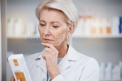 Buy stock photo Pharmacist, pharmacy and woman reading medicine label, pills or box in drugstore. Healthcare, thinking and elderly medical doctor looking at medication, antibiotics or drugs, vitamins or supplements.