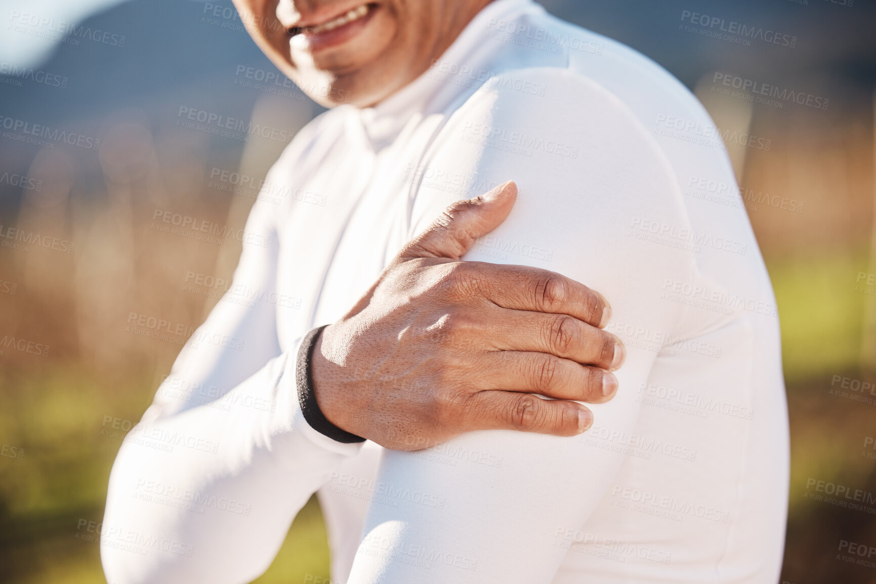 Buy stock photo Hand, shoulder and injury with a runner man outdoor for cardio or endurance exercise in nature. Pain, arm and emergency with a male athlete suffering from cramp after an accident while running