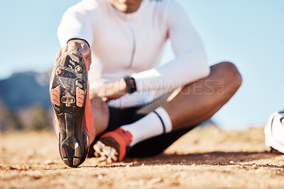 Buy stock photo Fitness, stretching and sports with shoes of man in nature for travel, cycling and cardio training. Practice, relax and start with athlete and warm up on trail for exercise, workout and commitment