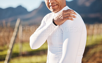 Buy stock photo Hand, arm and injury with a runner man outdoor for cardio or endurance exercise in nature. Pain, shoulder and emergency with a male athlete suffering from cramp after an accident while running