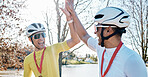 Cycling men or friends high five for sports winning, marathon travel award and countryside competition or race success. Winner athlete or people in teamwork, triathlon journey goals and support hands