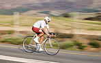 Cycling, fitness and man with bike on road, speed and action with motion blur of cyclist outdoor and helmet for safety. Mockup space, athlete and training for race, exercise in nature with bicycle