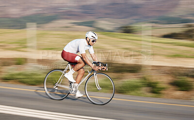 Buy stock photo Cycling, fitness and man with bike on road, speed and action with motion blur of cyclist outdoor and helmet for safety. Mockup space, athlete and training for race, exercise in nature with bicycle