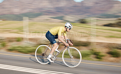 Buy stock photo Cycling, fitness and man with bicycle on road, speed and action, motion blur of cyclist outdoor and helmet for safety. Mockup space, athlete and training for race, exercise in countryside with bike