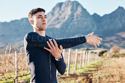 Buy stock photo Man, stretching arms with run and fitness outdoor, nature view with hiking or running in countryside, exercise and warm up. Serious, muscle and strong male runner, start with marathon or trekking