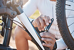 Repair, tools and hands of man with mountain bike for fitness, training and exercise in nature. Cycling, sports and adventure with cyclist fixing bicycle on trail for gears, maintenance or inspection