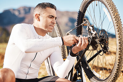 Buy stock photo Cycling, repair and wheel with man and focus for sports, wellness and fitness training. Insurance, safety and tire change with cyclist fixing mountain bike on trail for broken, puncture and check