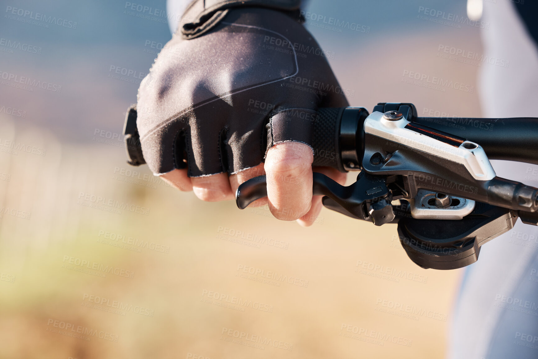 Buy stock photo Man hands, gloves and holding on bicycle for training, triathlon sports and cardio transportation. Closeup cyclist, bike gear and handlebar with lever, brakes and outdoor fitness for cycling athlete