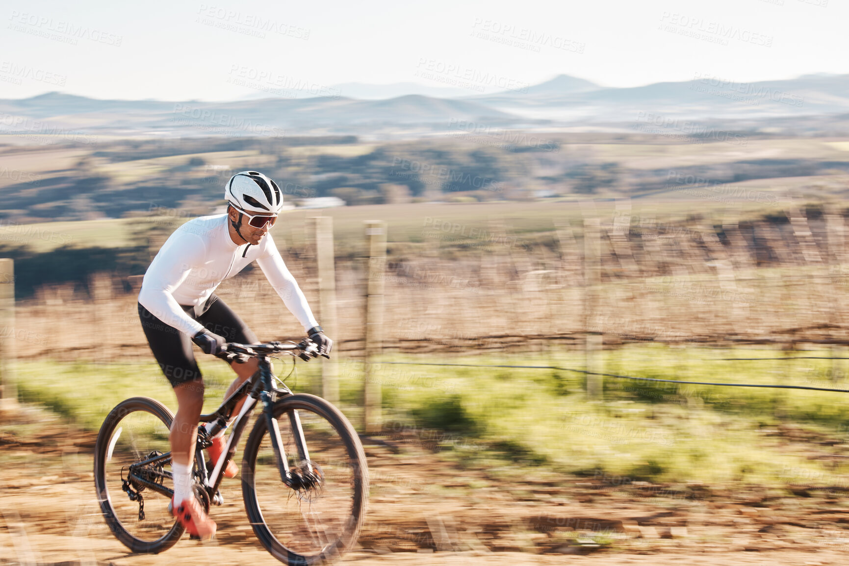 Buy stock photo Man, bike and cycling with motion blur in nature, countryside and training of triathlon, sports or power. Cyclist, bicycle and speed of off road travel, energy and freedom in action, wellness or path