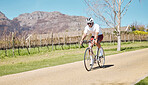 Man, athlete and bicycle in nature, sunshine and training for triathlon sports in Cape Town. Cyclist, mountain bike and cycling in field, off road path and outdoor fitness for performance in sunshine