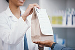 Pharmacy, product and pharmacist giving customer bag for pills prescription, medical supplements and medicine. Healthcare, dispensary and woman help man with medicare package, drugs and medication