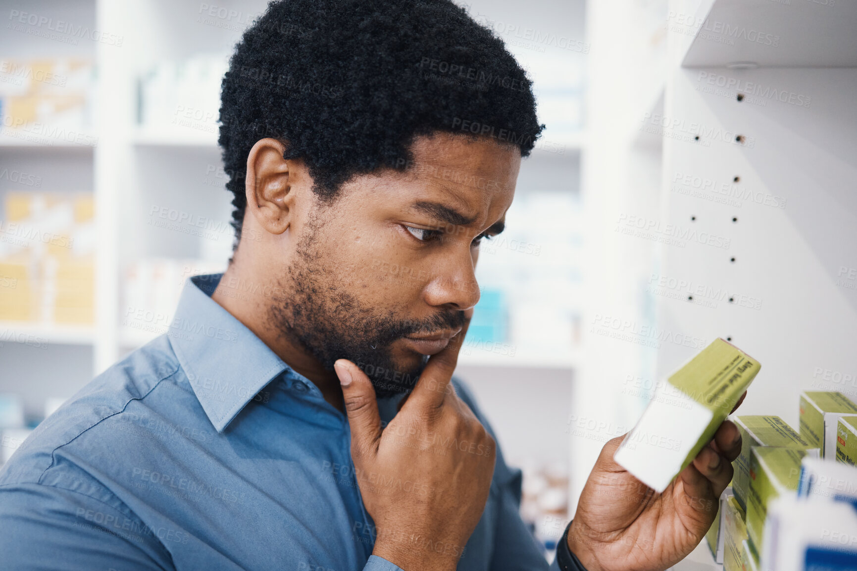 Buy stock photo Black man, shopping or box in pharmacy for medicine, reading or pills in retail healthcare in store. African customer, decision or sale for health, deal or thinking for benefits of medical product