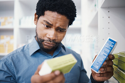 Buy stock photo Confused, doubt or patient with medicine, pharmacy pills or medical stock questions for healthcare, wellness or treatment choice. Black man, customer or drugstore tablets for pharmaceutical anxiety
