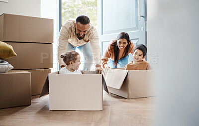 Buy stock photo Family play in cardboard box for new house, moving and real estate celebration, investment and excited children. Homeowner parents or mom, dad and kids in boxes game bonding in property home together