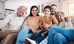 Relax, portrait and generations of family on sofa together, laughing and smiling in home or apartment. Men, women and children on couch, happy smile with grandparents, parents and kid in living room.