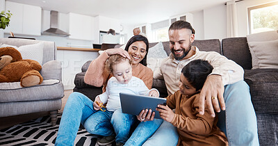 Buy stock photo Family, tablet and kids learning online in the living room of their home with parents for child development. Education, video or internet with a father, mother and children sitting on the floor
