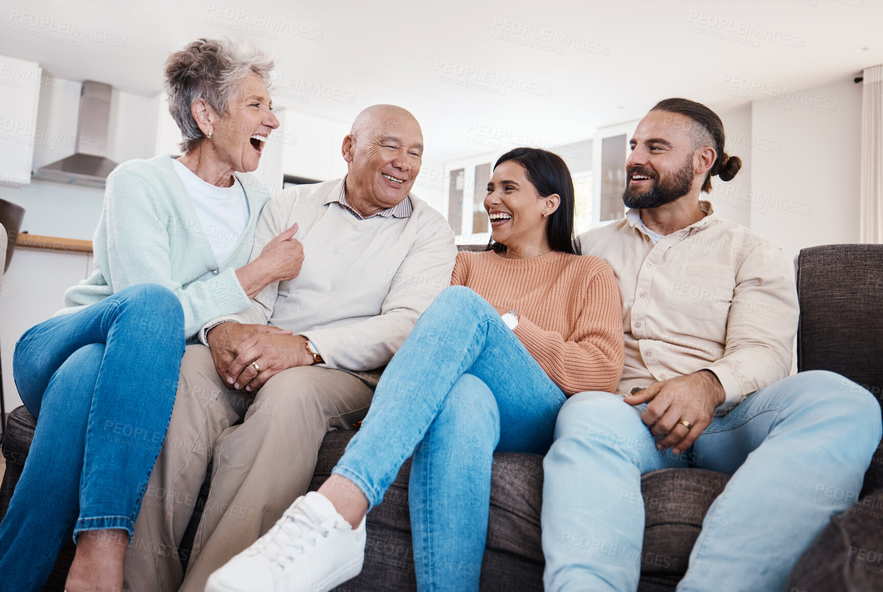 Buy stock photo Parents, couple and happy family bonding in a home or house together spending quality time sitting on a couch or sofa. Elderly, holiday and people relax and visit on vacation being carefree
