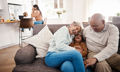 Buy stock photo Laughing, happy and grandparents babysitting a child, bonding and being funny on the sofa. Smile, comic and boy kid speaking to a senior man and woman on the living room couch for quality time