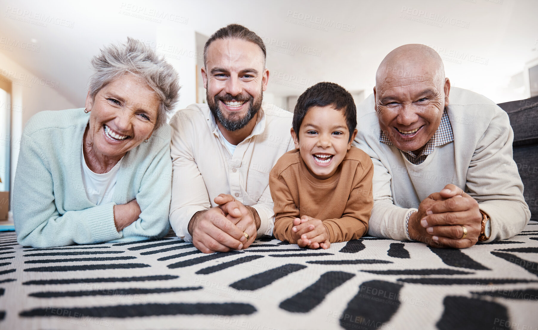Buy stock photo Happy family, portrait and living room floor in a home with a smile from bonding together. Happiness, bonding and love of senior people, father and child on a house carpet with grandma and kid
