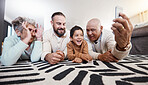 Happy big family, smile and take selfie in home living room for memory or social media. Photographer care, comic face and father, grandparents and child on floor taking pictures, bonding or laughing.