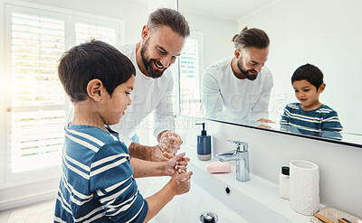 Buy stock photo Cleaning, washing hands and father with boy in bathroom for hygiene, wellness and healthcare at home. Family, skincare and dad with child learning to wash with water, soap and disinfection by faucet