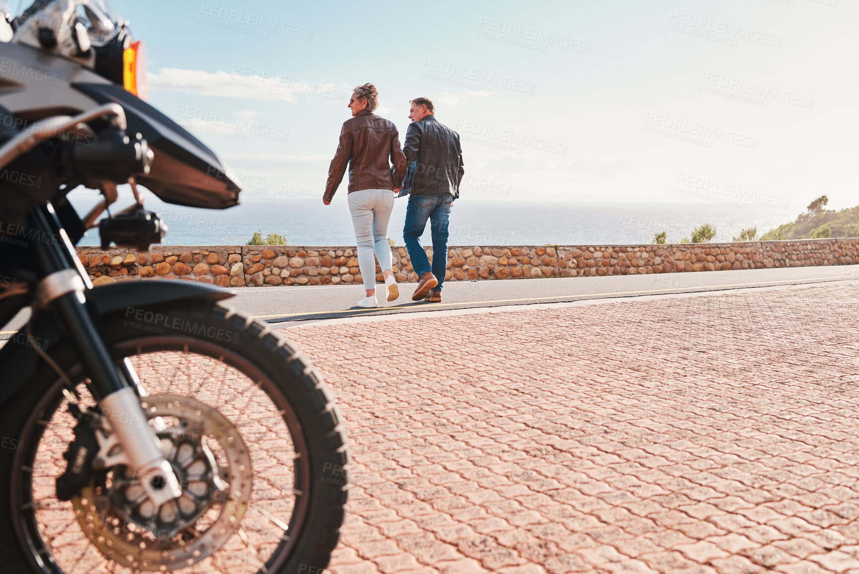 Buy stock photo Back, view and a biker couple on a road trip together in summer during retirement. Motorcycle, freedom or travel with a senior man and woman traveling along the coast while bonding on vacation