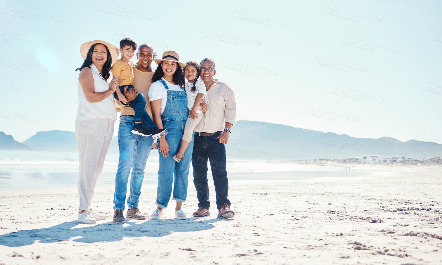 Buy stock photo Portrait of grandparents, parents and children at beach for bonding, quality time and relax together by sea. Big family, travel and happy mom and dad with kids on summer holiday, vacation and weekend