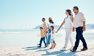 Buy stock photo Beach, walking and mock up with a black family holding hands outdoor in nature by the ocean at sunset together. Nature, love or kids with grandparents, parents and children taking a walk on the coast