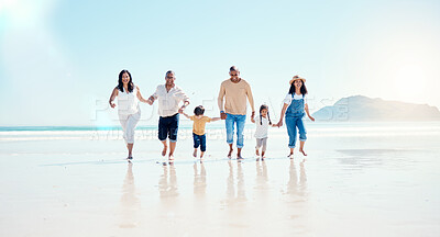 Buy stock photo Beach, walking and mockup with a black family holding hands outdoor in nature by the ocean at sunset together. Nature, love or kids with grandparents, parents and children taking a walk on the coast