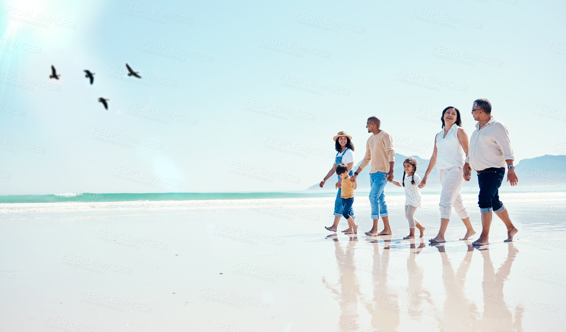 Buy stock photo Black family, mockup or children walking on the beach with their parents and grandparents during summer vacation. Sky, love or kids with senior people and grandchildren taking a walk on the sand