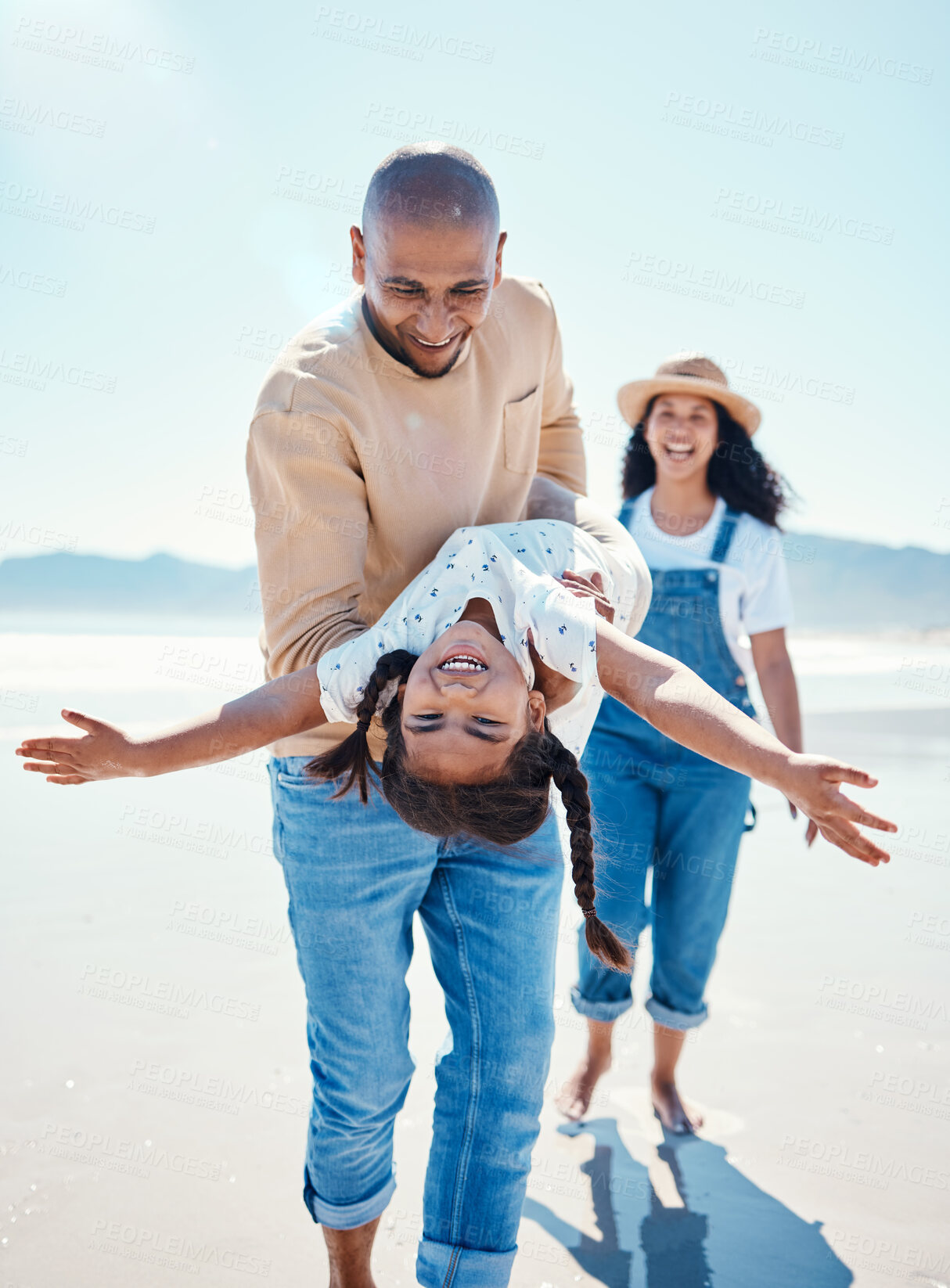 Buy stock photo Family, beach and parents play with girl for bonding, quality time and adventure together by ocean. Travel, love and happy mom, dad and child enjoy summer holiday, vacation and relax on weekend