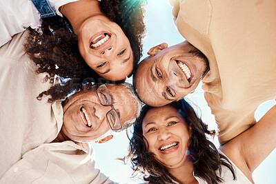 Buy stock photo Portrait, black family or huddle with senior parents and adult children standing in a circle together from below. Face, sky or love with a mature man and woman bonding with their son or daughter