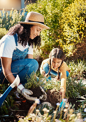 Buy stock photo Family, children or gardening with a mother and daughter planting plants in the backyard together. Nature, kids or landscaping with a woman and female child working in the garden during spring