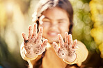 Dirt soil hands, girl child and gardening mockup with blurred background with smile, happiness and outdoor. Kid, garden development and backyard for sustainability, learning and ecology for growth
