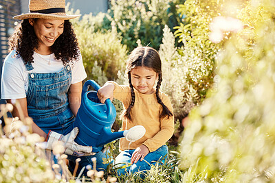 Buy stock photo Family, children or watering with a mother and daughter gardening together in the backyard. Plants, kids or landscaping with a woman and female child working in the garden during spring