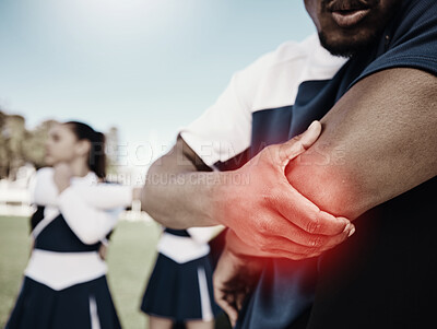 Buy stock photo Cheerleader, sports or hand on elbow injury, pain or accident on field in game or training match. Red glow, fitness zoom or cheerleading male person with a medical emergency, joint or muscle sprain